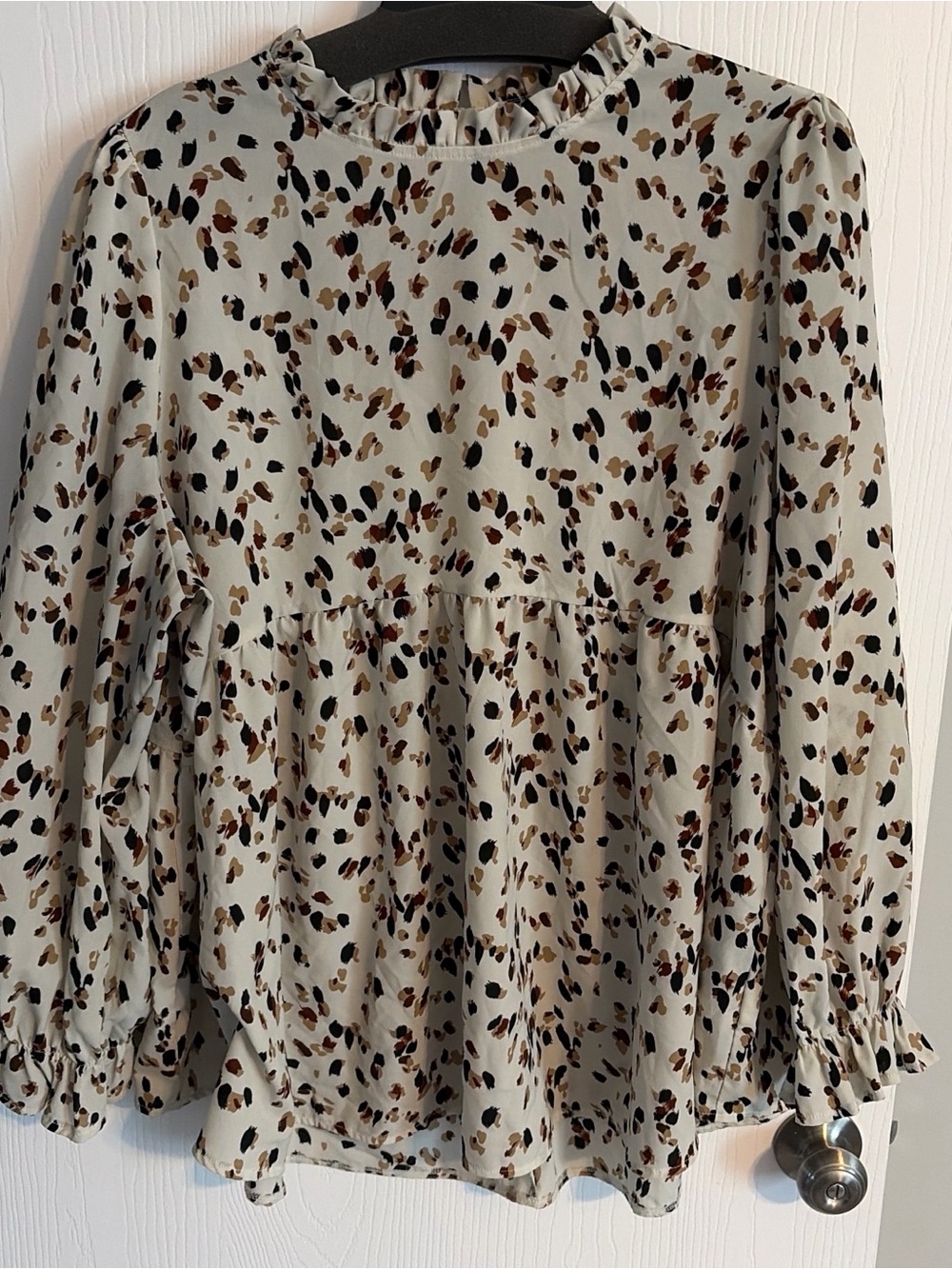 Cream Printed Ruffle Neck Peplum Blouse